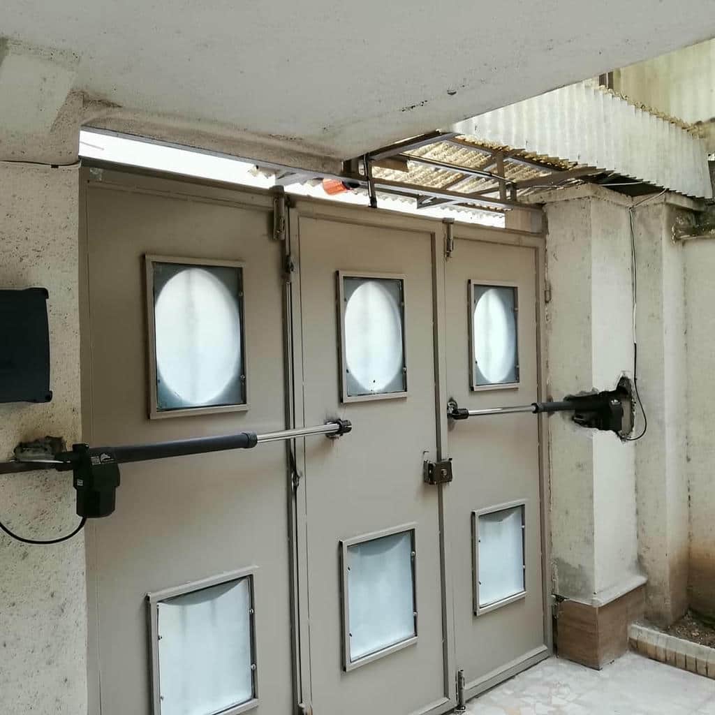 خدمات جک درب پارکینگ ایرانی بازویی برای مجتمع در شیراز